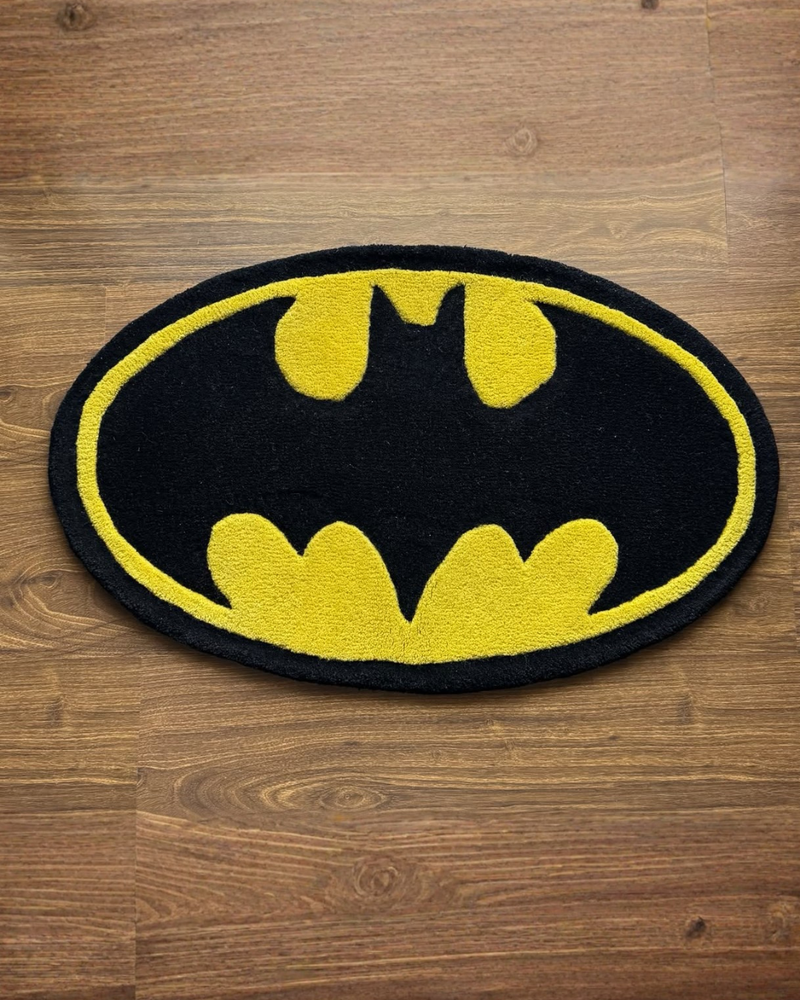 Batman logo rug on a wooden floor