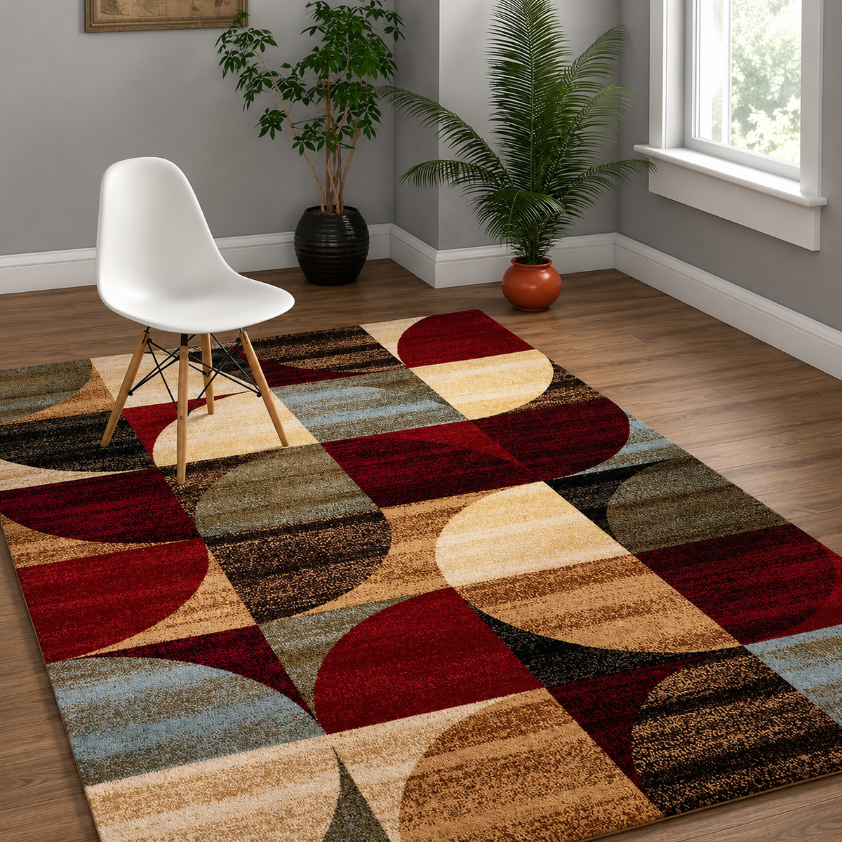 Multicolored geometric patterned rug on a wooden floor with a white chair and plants.